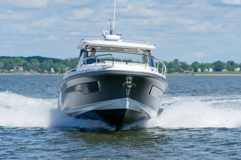 Slide: The Image of Nimbus W11 #46 boat cruising on open water, 2025 model. - 3