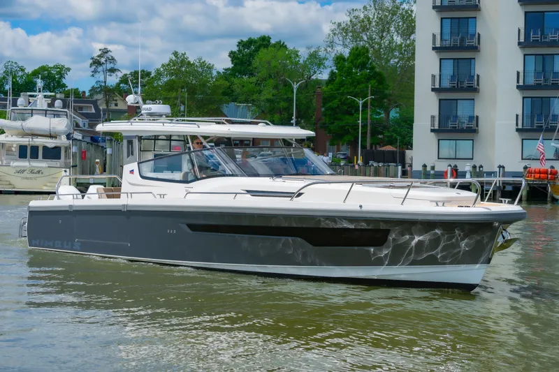 Slide: The Image of Luxury Nimbus W11 #46 yacht cruising near waterfront buildings, 2025 model. - 30