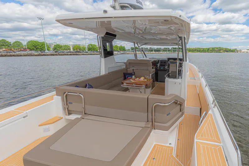 Slide: The Image of Luxurious Nimbus W11 #46 yacht, 2025 model, featuring spacious deck and elegant seating on the water. - 34