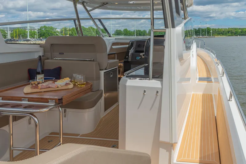 Slide: The Image of Luxurious 2025 Nimbus W11 #46 yacht interior with dining setup and scenic water view. - 35
