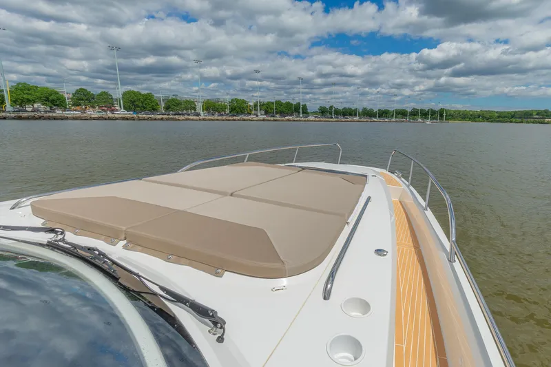 Slide: The Image of Luxurious 2025 Nimbus W11 #46 yacht deck with sunbathing area on calm water. - 36