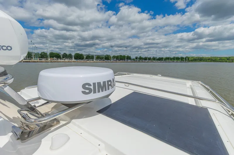 Slide: The Image of Rooftop view of Nimbus W11 #46 boat, featuring Simrad equipment, under a partly cloudy sky. - 37
