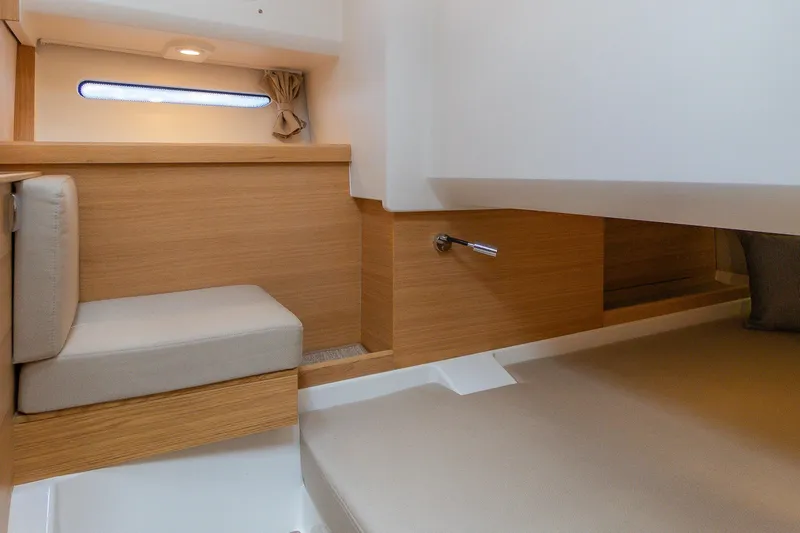 Slide: The Image of Modern interior of Nimbus W11 #46 yacht, featuring sleek wood finishes and cozy seating, 2025 model. - 43