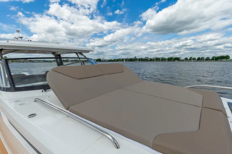 Slide: The Image of Luxurious Nimbus W11 #46 yacht with spacious sunbed, 2025 model, on serene water. - 56