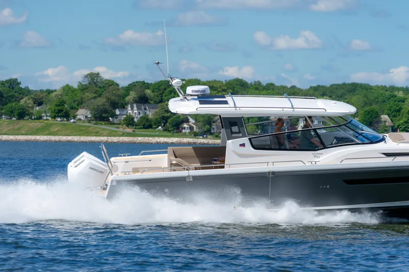Slide: The Image of Nimbus W11 #46 boat cruising on a sunny day, 2025 model. - 6