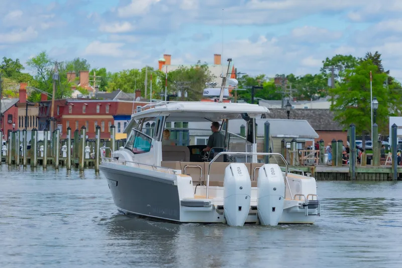 Slide: The Image of Nimbus W11 #46 boat cruising near a dock, 2025 model, scenic waterfront view. - 61