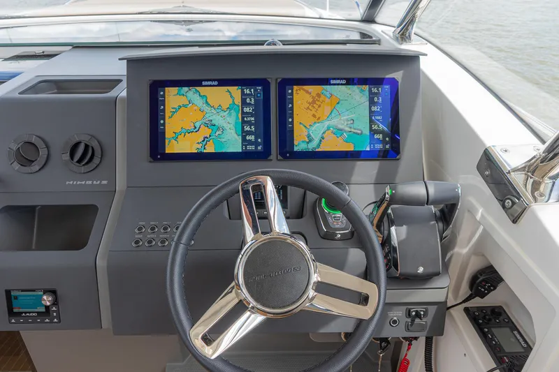 Slide: The Image of Steering console of 2025 Nimbus W11 #46 boat with dual navigation screens. - 66