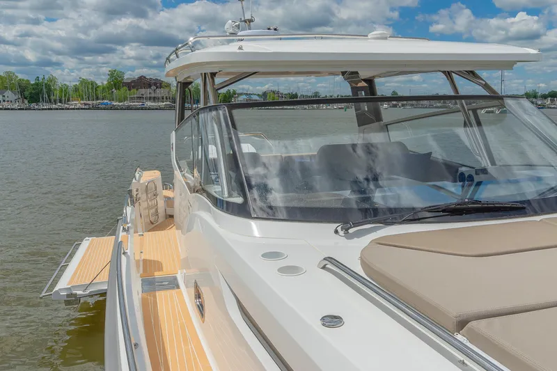 Slide: The Image of Luxurious 2025 Nimbus W11 #46 yacht on serene water, showcasing sleek design and spacious deck. - 71