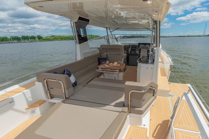 Slide: The Image of Luxurious 2025 Nimbus W11 #46 yacht interior with spacious seating and scenic water view. - 73
