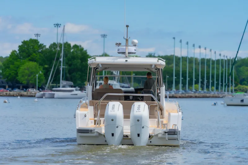 Slide: The Image of Nimbus W11 #46 boat cruising on a calm lake, 2025 model. - 8