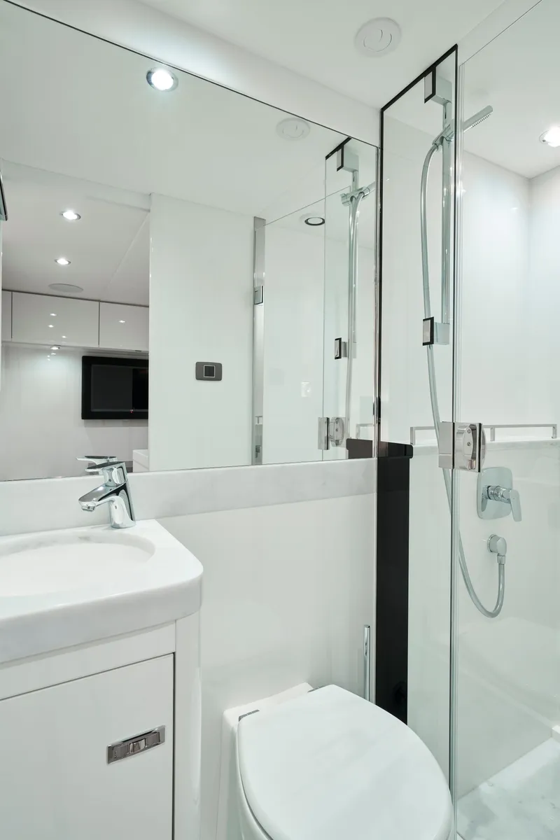Slide: The Image of Luxurious bathroom in 2025 Princess Y95 Motor Yacht with modern fixtures and glass shower. - 18