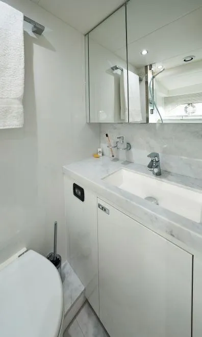 Slide: The Image of Luxurious bathroom in 2025 Princess Y95 Motor Yacht with modern fixtures and sleek design. - 19
