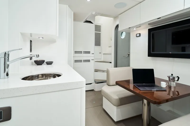 Slide: The Image of Luxurious interior of 2025 Princess Y95 Motor Yacht with modern kitchen and dining area. - 22