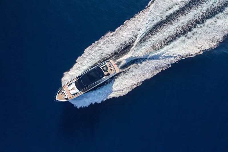 Slide: The Image of Aerial view of 2025 Princess Y95 Motor Yacht cruising on open water. - 5