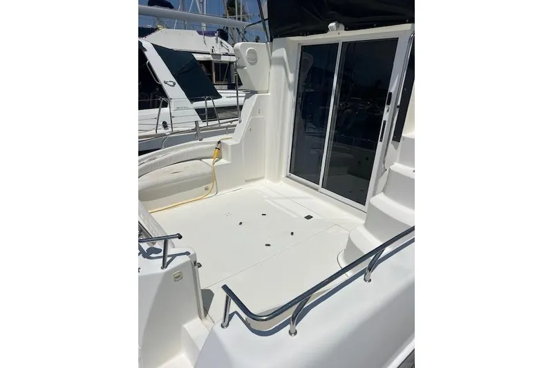 Slide: The Image of 1997 Silverton 351 Sedan boat deck with sliding glass doors and railing. - 11