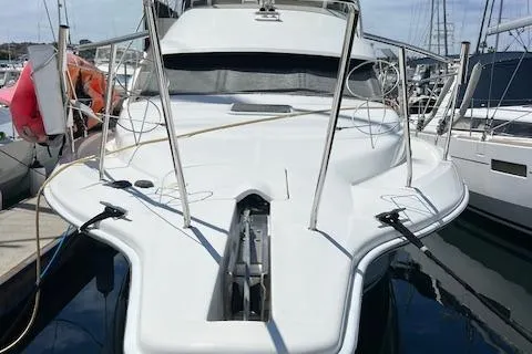 Slide: The Image of 1997 Silverton 351 Sedan Cruiser docked at marina, front view. - 3