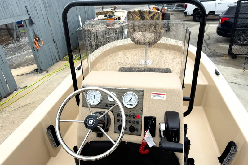 Slide: The Image of 2026 Carolina Skiff E18 JVX CC Sportsman boat dashboard with steering wheel and controls. - 10