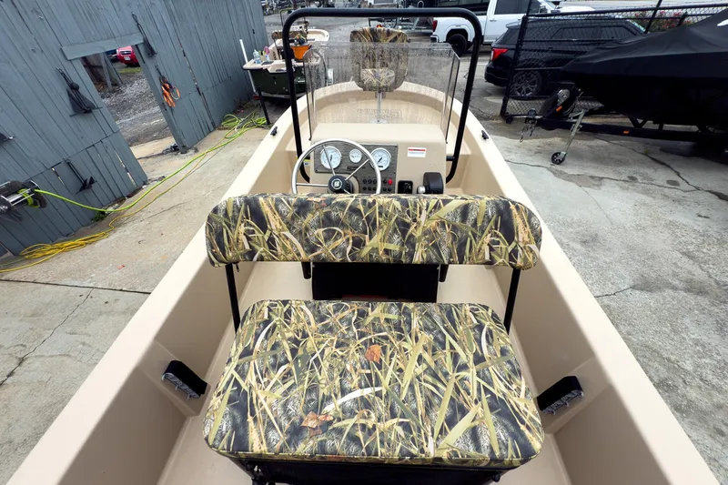Slide: The Image of 2026 Carolina Skiff E18 JVX CC Sportsman boat with camo seats and steering console. - 15