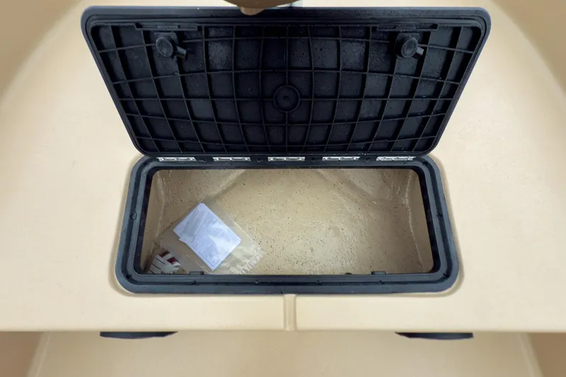 Slide: The Image of Open storage compartment in 2026 Carolina Skiff E18 JVX CC Sportsman boat. - 26