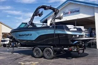 Slide: The Image of 2025 MasterCraft XT22 T boat on trailer at Dyer Marine dealership. - 3