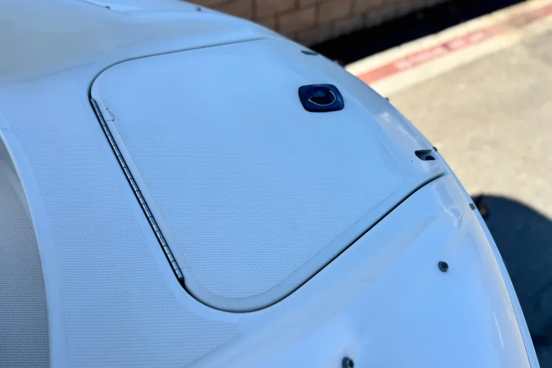 Slide: The Image of Close-up of a 2000 Sea Ray 240 Sundeck boat hatch detail. - 14