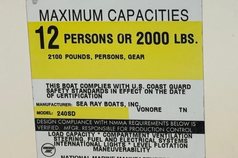 Slide: The Image of Capacity label for 2000 Sea Ray 240 Sundeck, max 12 persons or 2000 lbs. - 30