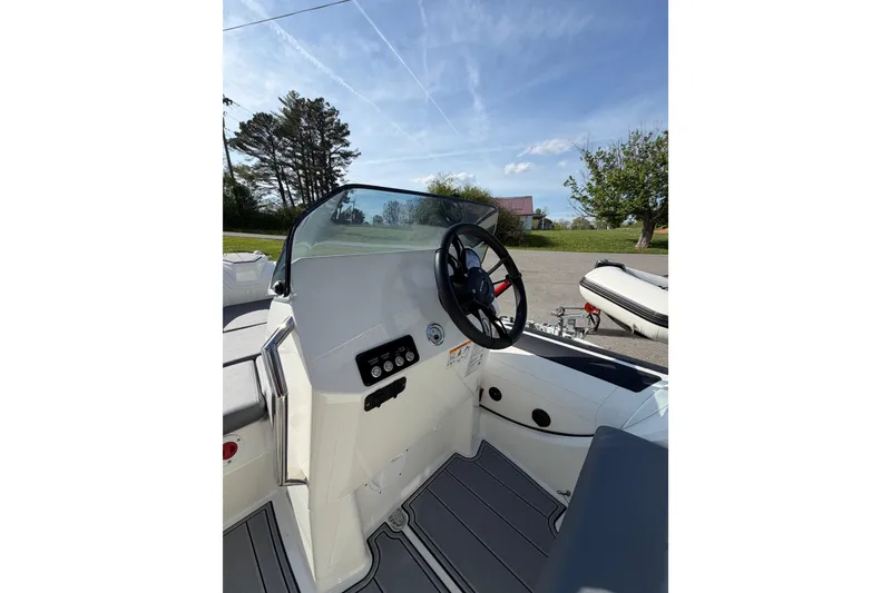 Slide: The Image of 2026 Brig Eagle 4 boat cockpit with steering wheel and control panel. - 5