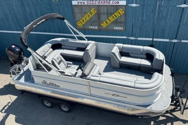 The Image of 2025 Sun Tracker Party Barge 20 DLX pontoon boat on trailer at Sizzle Marine. - 0