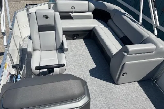 Slide: The Image of 2025 Sun Tracker Party Barge 20 DLX interior with gray seating and spacious layout. - 17