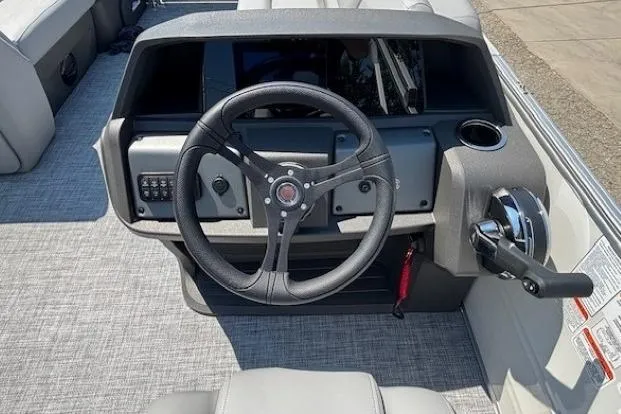 Slide: The Image of Steering console of 2025 Sun Tracker Party Barge 20 DLX pontoon boat. - 24