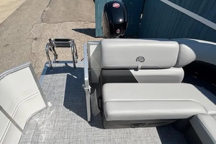 Slide: The Image of 2025 Sun Tracker Party Barge 20 DLX with gray seating and outboard motor. - 27