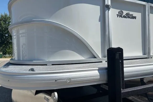 Slide: The Image of 2025 Sun Tracker Party Barge 20 DLX pontoon boat, side view, silver exterior. - 7