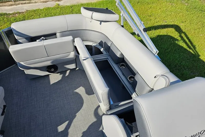 Slide: The Image of 2026 Bentley Pontoons LE 180 Cruise interior with luxurious gray seating and spacious layout. - 12