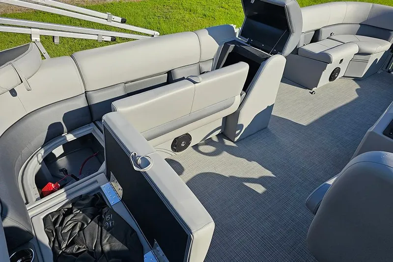 Slide: The Image of 2026 Bentley Pontoons LE 180 Cruise interior with plush gray seating and carpeted flooring. - 13