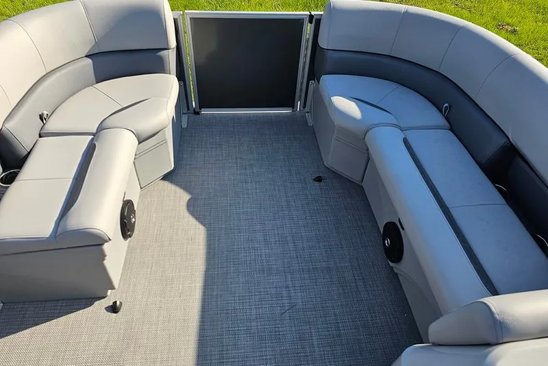 Slide: The Image of 2026 Bentley Pontoons LE 180 Cruise interior with steering console and captain's chair. - 19
