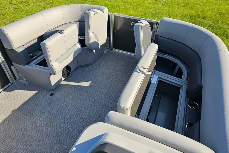 Slide: The Image of 2026 Bentley Pontoons LE 180 Cruise interior with open storage compartment and seating. - 20