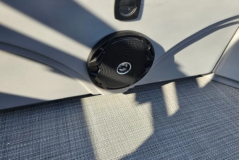 Slide: The Image of 2026 Bentley Pontoons LE 180 Cruise interior with dual cup holders and sleek upholstery. - 24