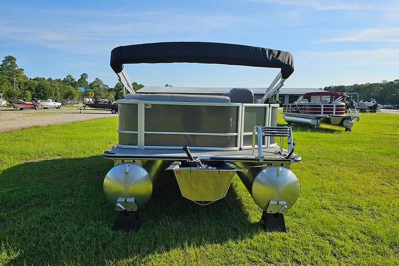 Slide: The Image of 2026 Bentley Pontoons LE 180 Cruise on grass, showcasing sleek design and modern features. - 8