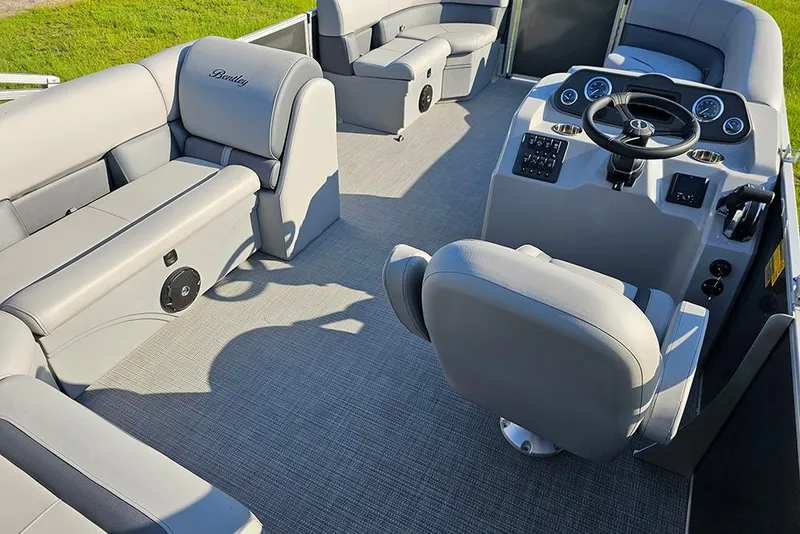 Slide: The Image of 2026 Bentley Pontoons LE 180 Cruise on grass, showcasing sleek design and modern features. - 9
