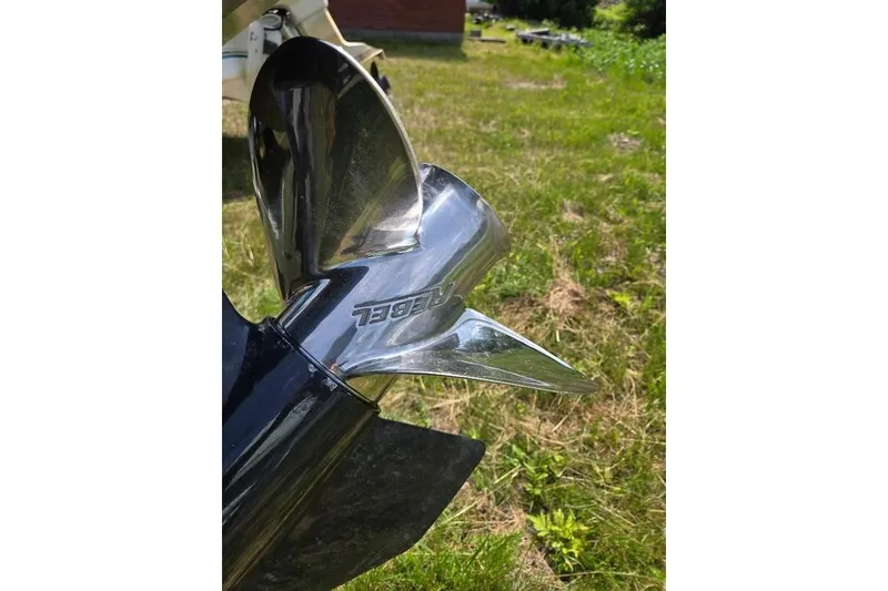 Slide: The Image of Close-up of a shiny boat propeller on a 2019 Manitou Legacy 25 RFXW. - 14