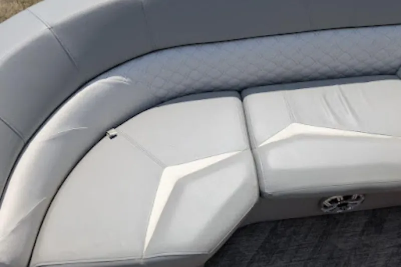 Slide: The Image of 2019 Manitou Legacy 25 RFXW boat seating with gray upholstery and quilted backrest. - 17