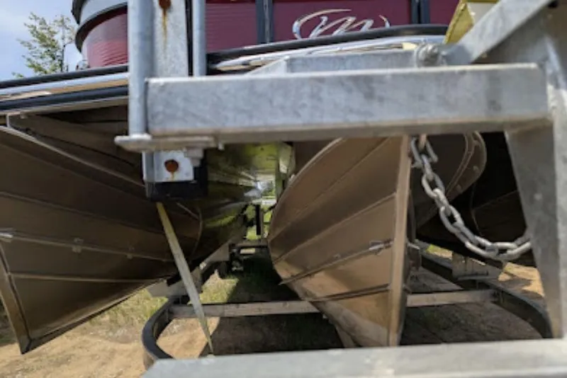 Slide: The Image of Underneath view of a 2019 Manitou Legacy 25 RFXW pontoon boat on a trailer. - 19