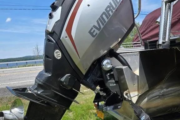 Slide: The Image of 2019 Manitou Legacy 25 RFXW pontoon boat with Evinrude outboard motor, rear view. - 9