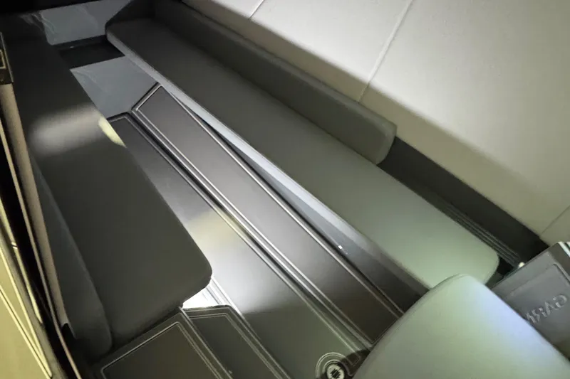 Slide: The Image of Interior seating of 2026 Sunsation 32 CCX boat, featuring sleek, modern design. - 14