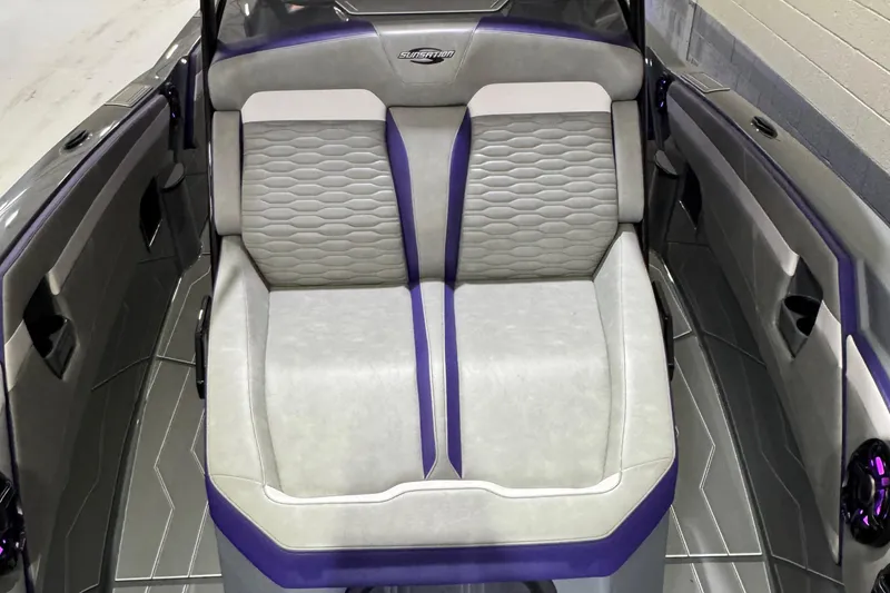 Slide: The Image of 2026 Sunsation 32 CCX boat interior with modern gray and purple seating design. - 15
