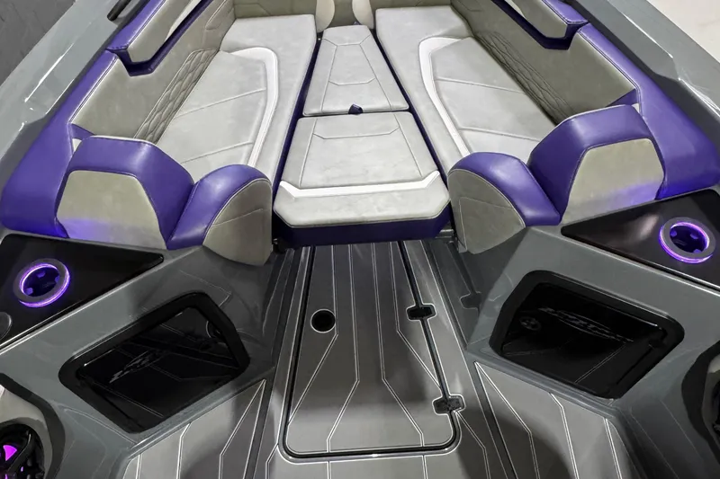 Slide: The Image of 2026 Sunsation 32 CCX boat interior with purple and gray seating, modern design. - 19