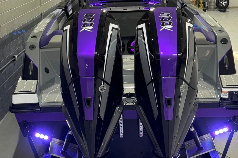Slide: The Image of 2026 Sunsation 32 CCX boat with dual 500R engines, featuring sleek purple and black design. - 6