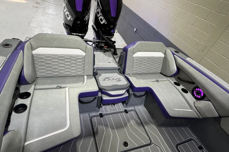 Slide: The Image of 2026 Sunsation 32 CCX boat interior with gray and purple seating, dual engines, and modern design. - 7