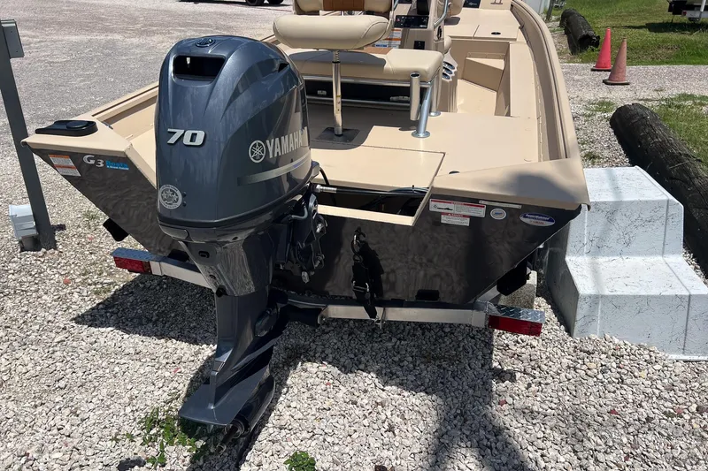 Slide: The Image of 2025 G3 Bay 17 boat with Yamaha 70 outboard motor on gravel surface. - 4