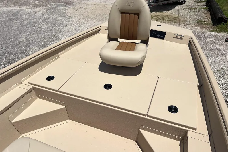 Slide: The Image of 2025 G3 Bay 17 boat deck with beige seating and storage compartments. - 7